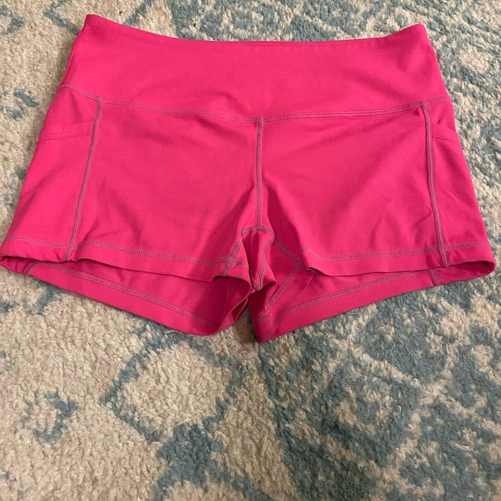Feed Me Fight Me pink workout shorts